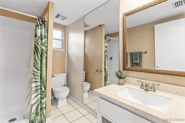 bathroom with a shower with curtain, tile patterned flooring, vanity, and toilet