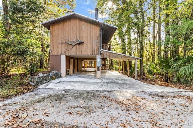 exterior space featuring a carport