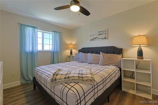 bedroom with ceiling fan and dark hardwood / wood-style flooring