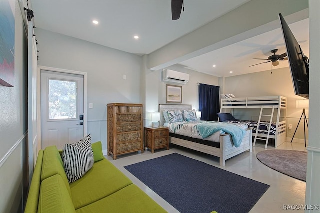 bedroom featuring ceiling fan and a wall unit AC