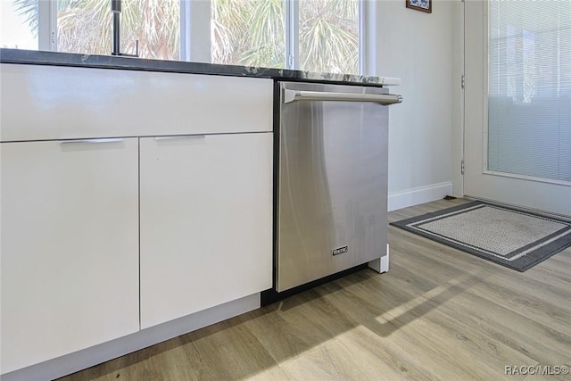 interior space featuring dishwasher and light hardwood / wood-style flooring