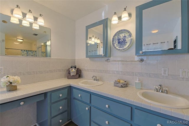 bathroom featuring vanity, backsplash, and a shower with shower curtain