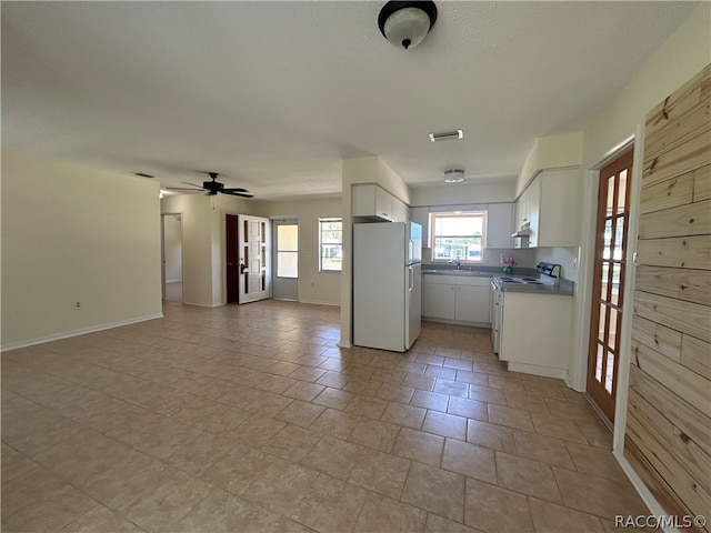 kitchen featuring white appliances, white cabinetry, ceiling fan, and sink