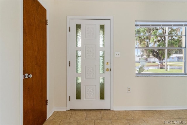 tiled entryway with a wealth of natural light