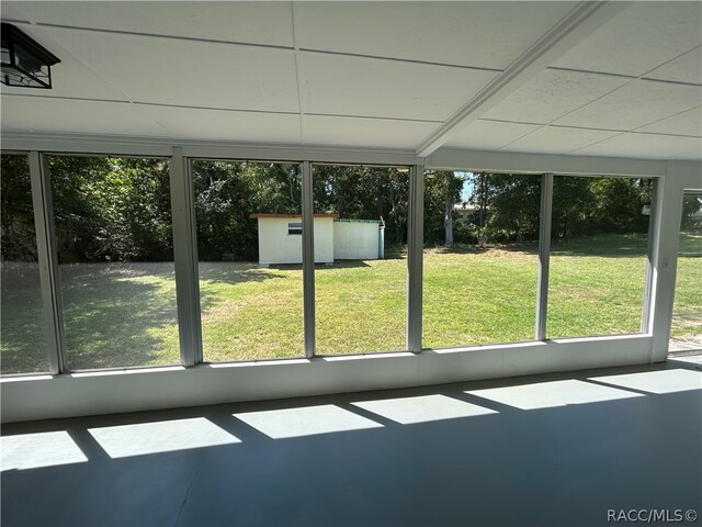 unfurnished sunroom with a wealth of natural light