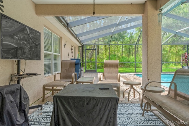 sunroom / solarium with lofted ceiling and a wealth of natural light