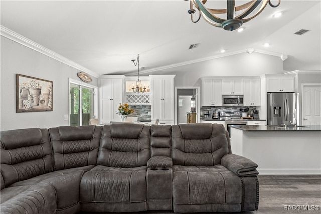 living room with lofted ceiling, visible vents, dark wood finished floors, and crown molding