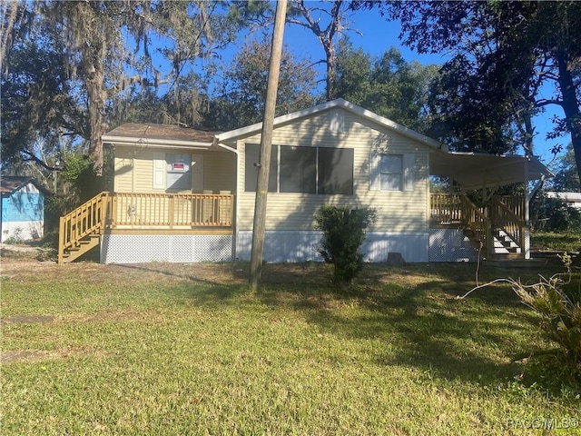 exterior space with a yard and a wooden deck