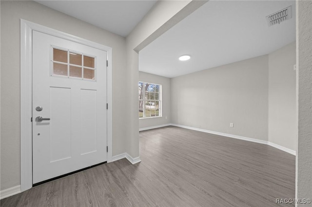 entryway with hardwood / wood-style flooring