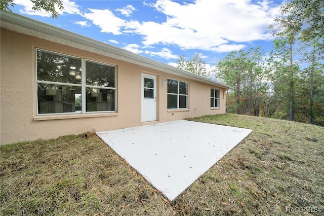 back of house with a patio area