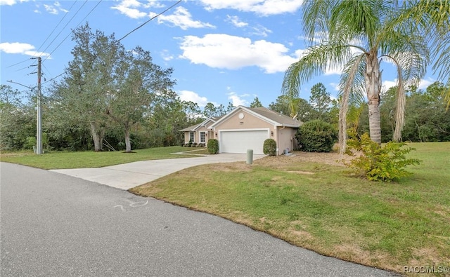 view of front of property featuring a front lawn and a garage