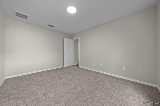 spare room featuring carpet flooring