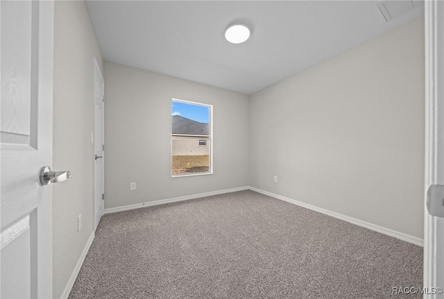 unfurnished room with carpet flooring