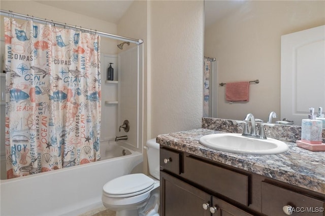 full bathroom with vanity, shower / tub combo, and toilet