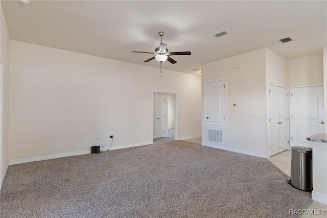 carpeted empty room featuring ceiling fan