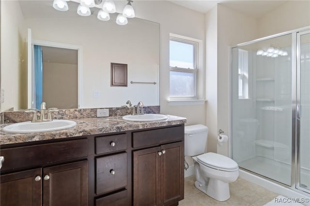 bathroom with tile patterned flooring, vanity, an enclosed shower, and toilet