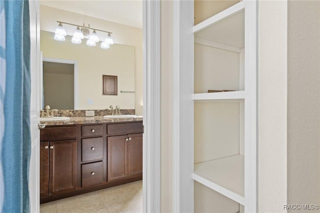 bathroom with vanity and tile patterned flooring