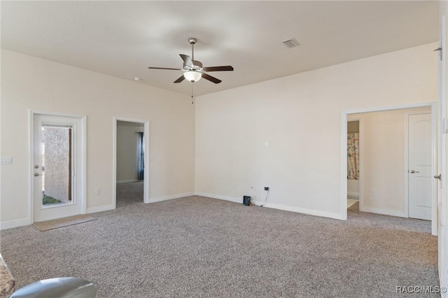 interior space featuring light colored carpet and ceiling fan