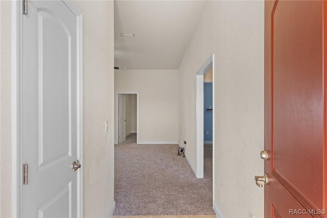 hallway with light carpet