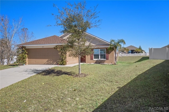 view of front of property with a garage and a front lawn