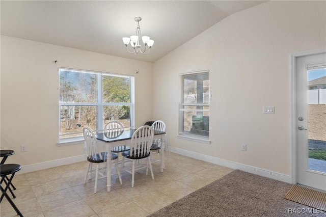 dining room with light tile patterned floors, vaulted ceiling, and a chandelier