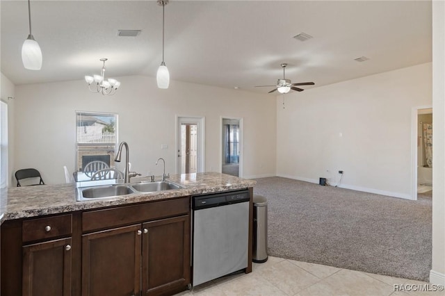 kitchen featuring sink, hanging light fixtures, light carpet, stainless steel dishwasher, and plenty of natural light