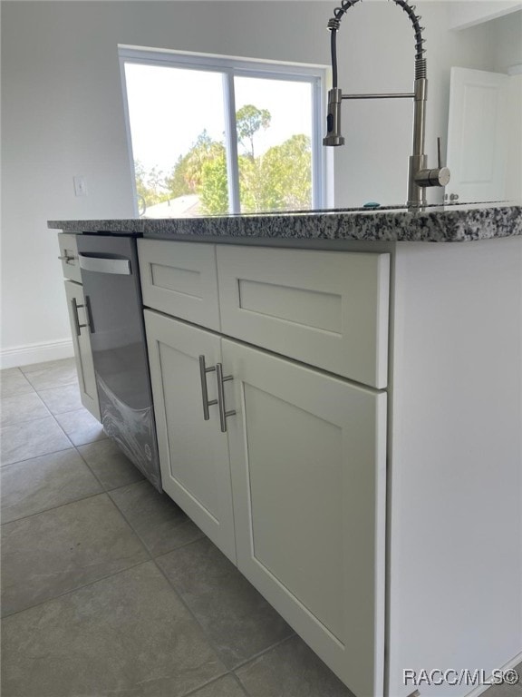 room details with dishwasher and white cabinetry