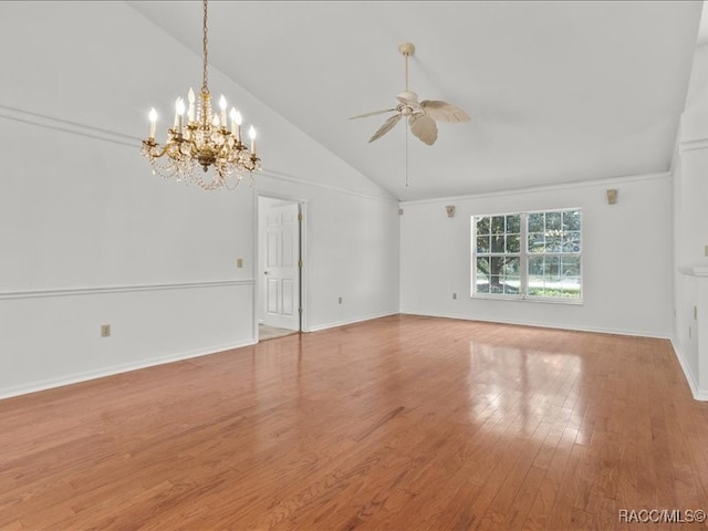 spare room featuring ceiling fan with notable chandelier, light wood-type flooring, and high vaulted ceiling