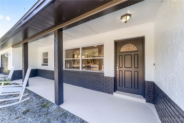 entrance to property with a porch