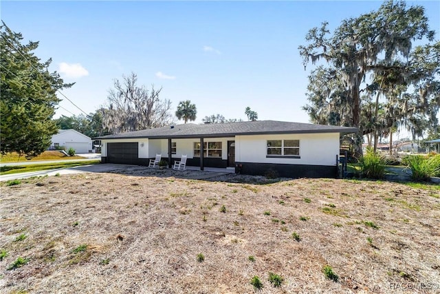 single story home with a garage