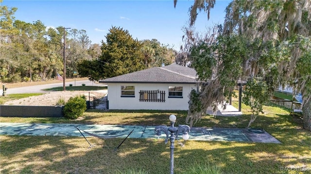 view of property exterior with a yard