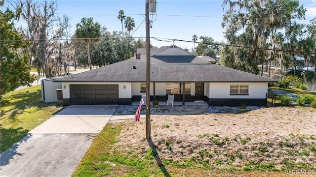 single story home featuring a garage