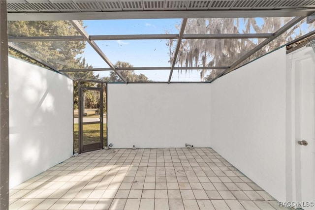 view of patio / terrace featuring a lanai