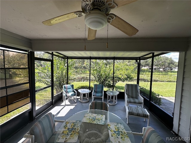 sunroom featuring ceiling fan