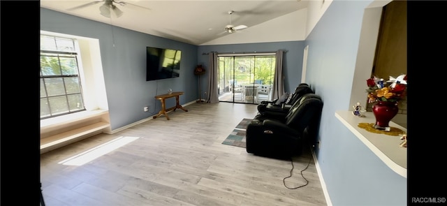 sitting room featuring ceiling fan, light hardwood / wood-style flooring, and vaulted ceiling