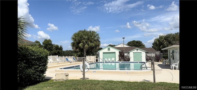 view of swimming pool with a patio