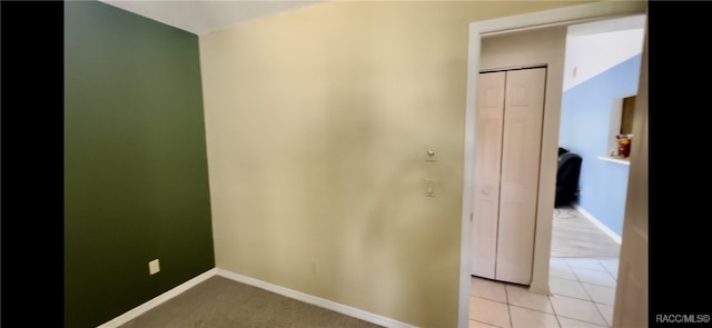 hallway featuring light tile patterned flooring