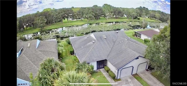 drone / aerial view with a water view