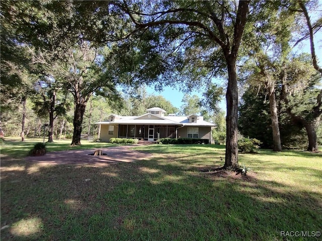 7802 N Fairwind Loop, Hernando, FL 34442 - view of green lawn with covered porch