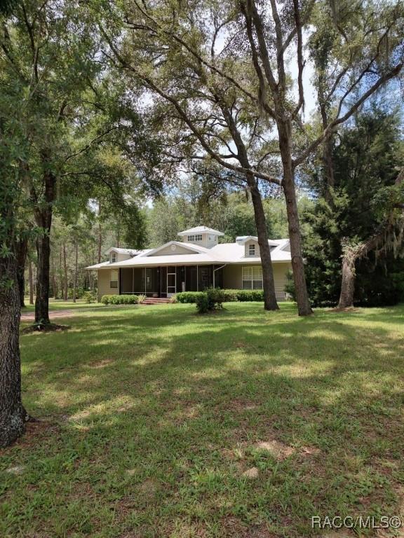 7802 N Fairwind Loop, Hernando, FL 34442 - view of grassy yard
