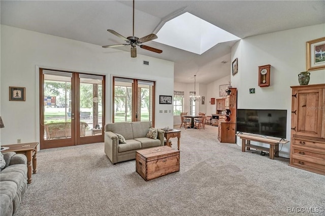 7802 N Fairwind Loop, Hernando, FL 34442 - carpeted living room with vaulted ceiling, ceiling fan, a chandelier, and french doors