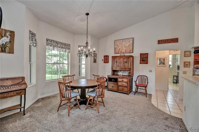 7802 N Fairwind Loop, Hernando, FL 34442 - dining space with a chandelier, light colored carpet, vaulted ceiling, and light tile patterned flooring