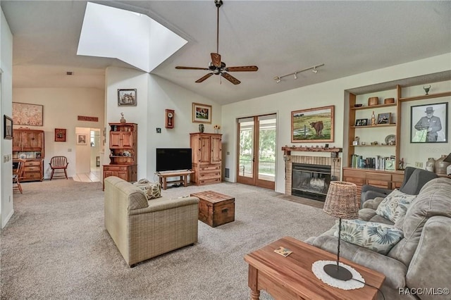7802 N Fairwind Loop, Hernando, FL 34442 - living room with light colored carpet, a fireplace, ceiling fan, and vaulted ceiling