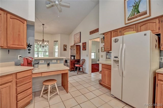 7802 N Fairwind Loop, Hernando, FL 34442 - kitchen featuring white refrigerator with ice dispenser, high vaulted ceiling, a chandelier, plenty of natural light, and a ceiling fan