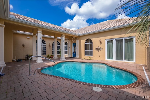 view of swimming pool featuring a patio area