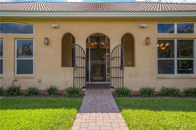 property entrance with a yard