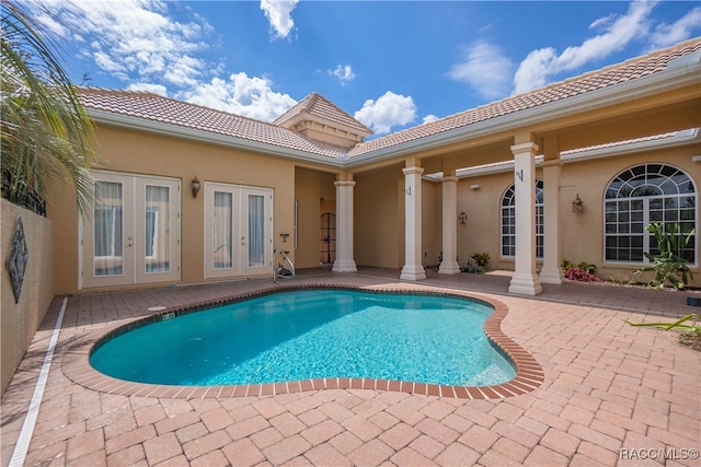 view of swimming pool with a patio area