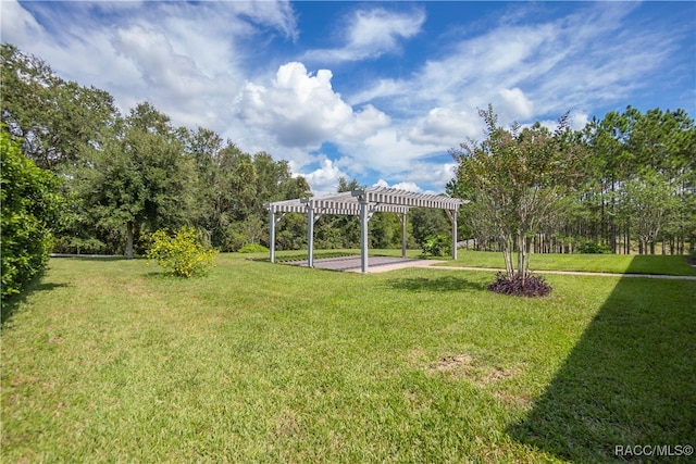 surrounding community featuring a pergola and a yard