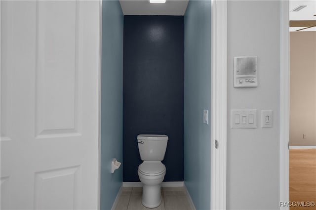 bathroom featuring tile patterned flooring and toilet