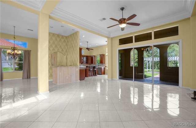 interior space featuring ceiling fan with notable chandelier, ornamental molding, light tile patterned floors, and french doors